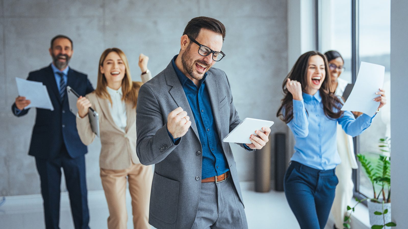 Leadership team celebrating measurable results
