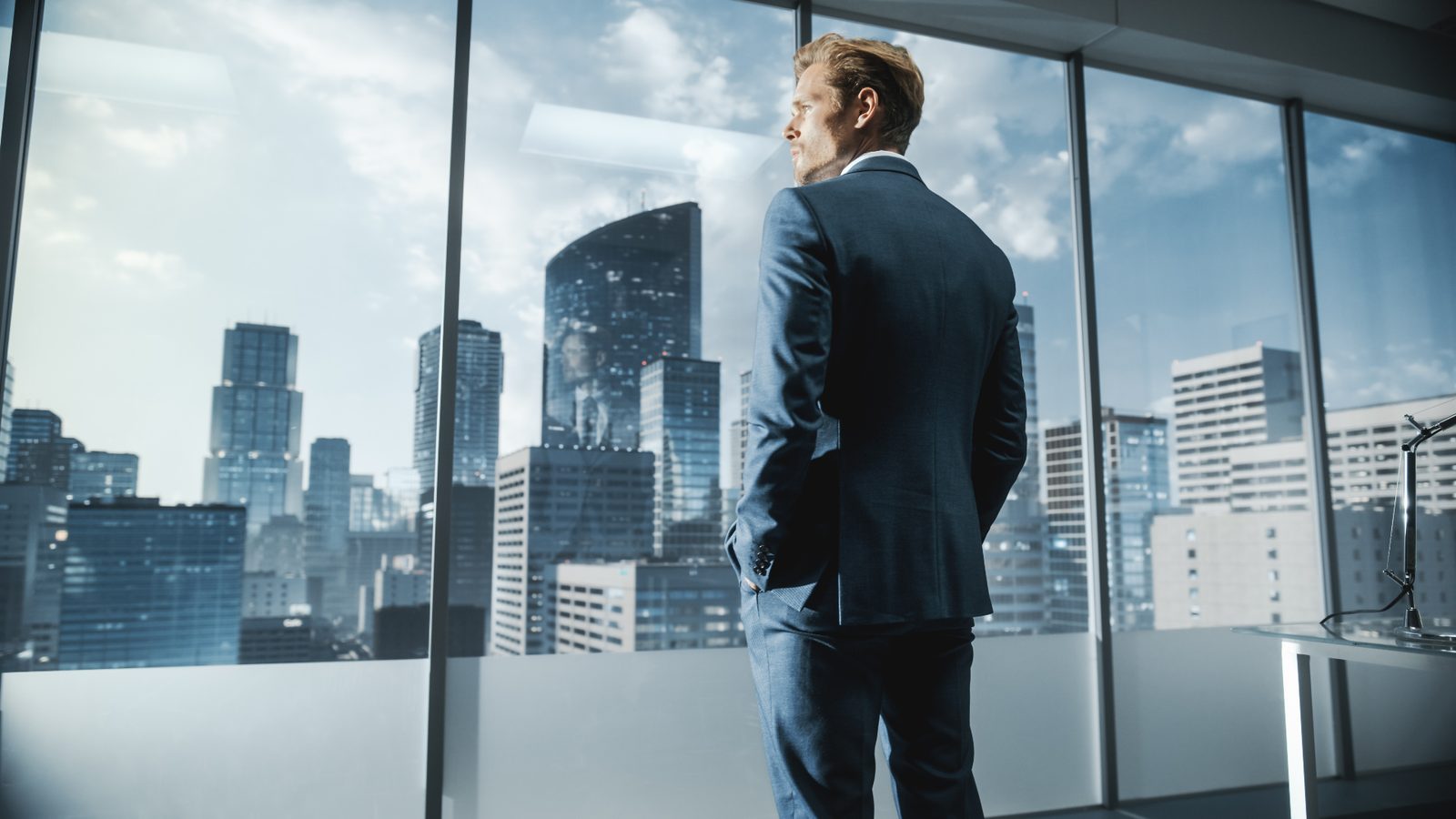 A senior leader looks out over the city — the view from the top is wide, but not always complete